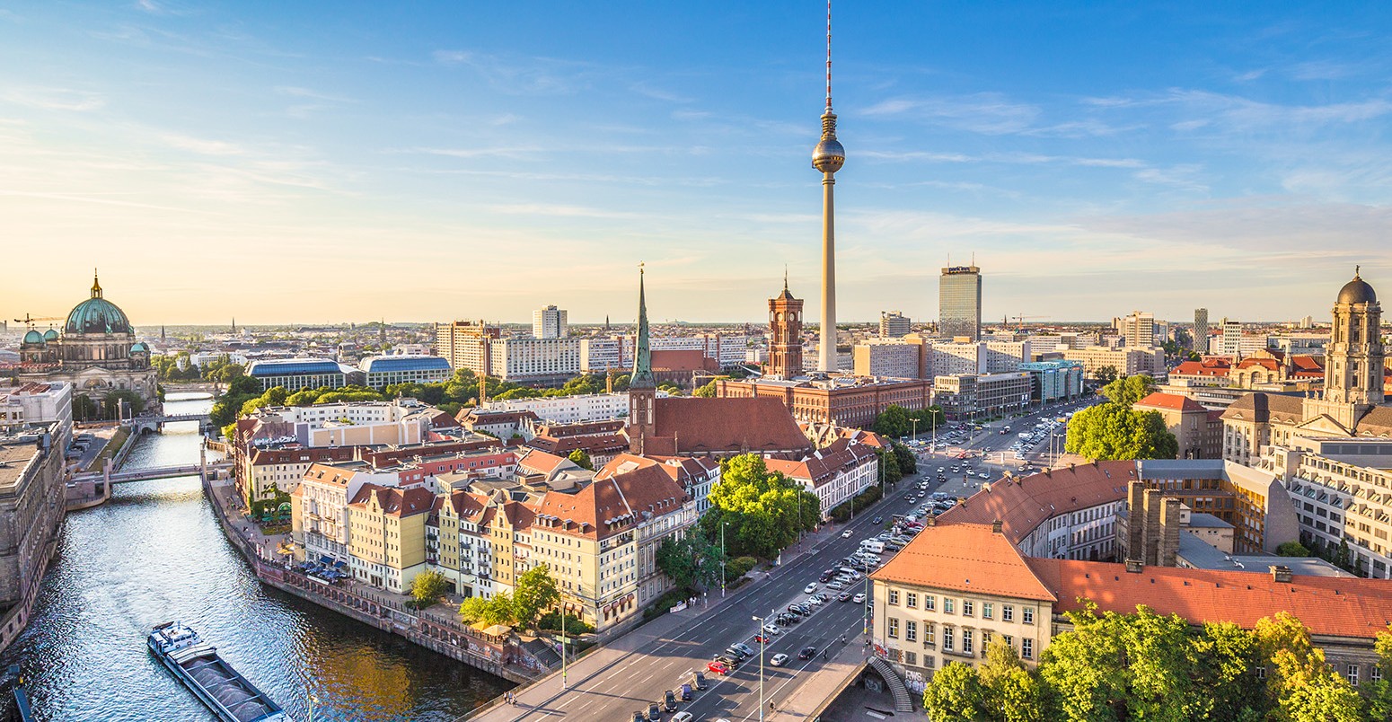 Aerial view of Berlin skyline and Spree river in beautiful evening light at sunset in summer, Germany