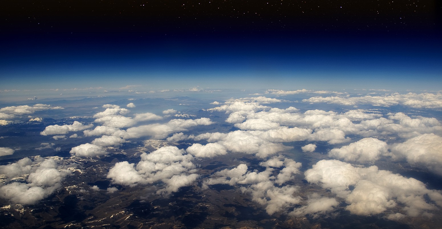 High altitude view of the Earth in space with stars. The desert in the western United States.