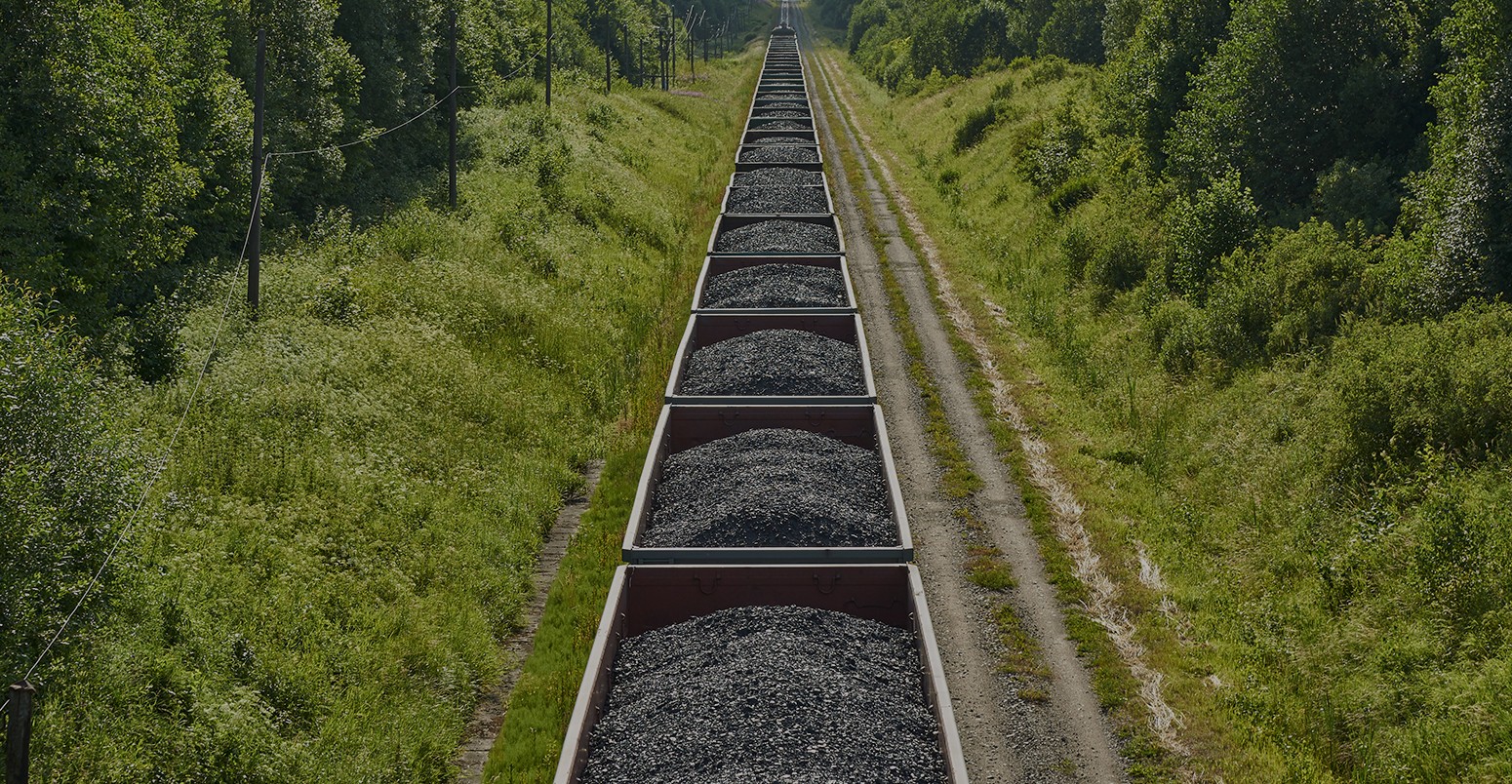 Railway cargo cars carrying coal