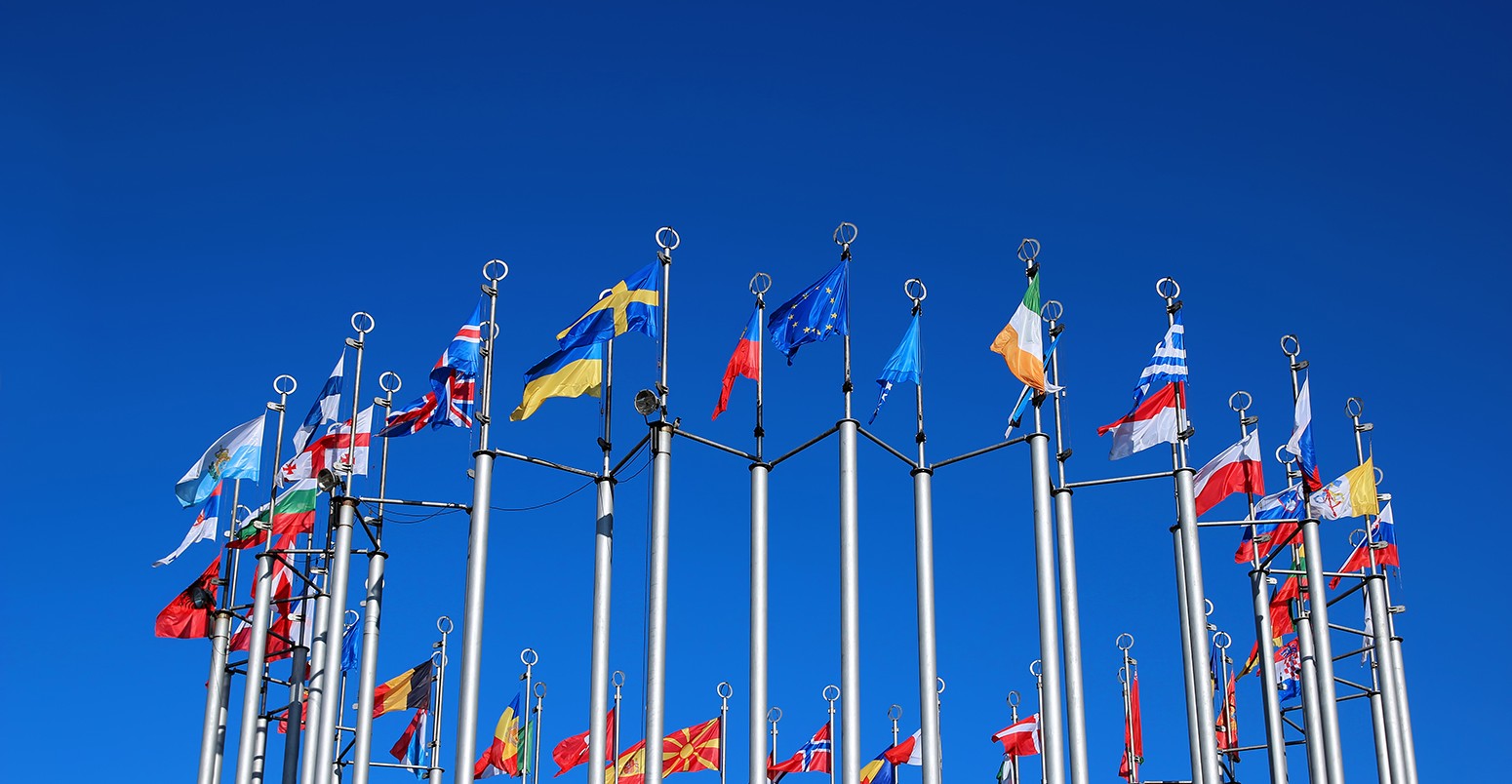 Flags of European countries against the blue sky