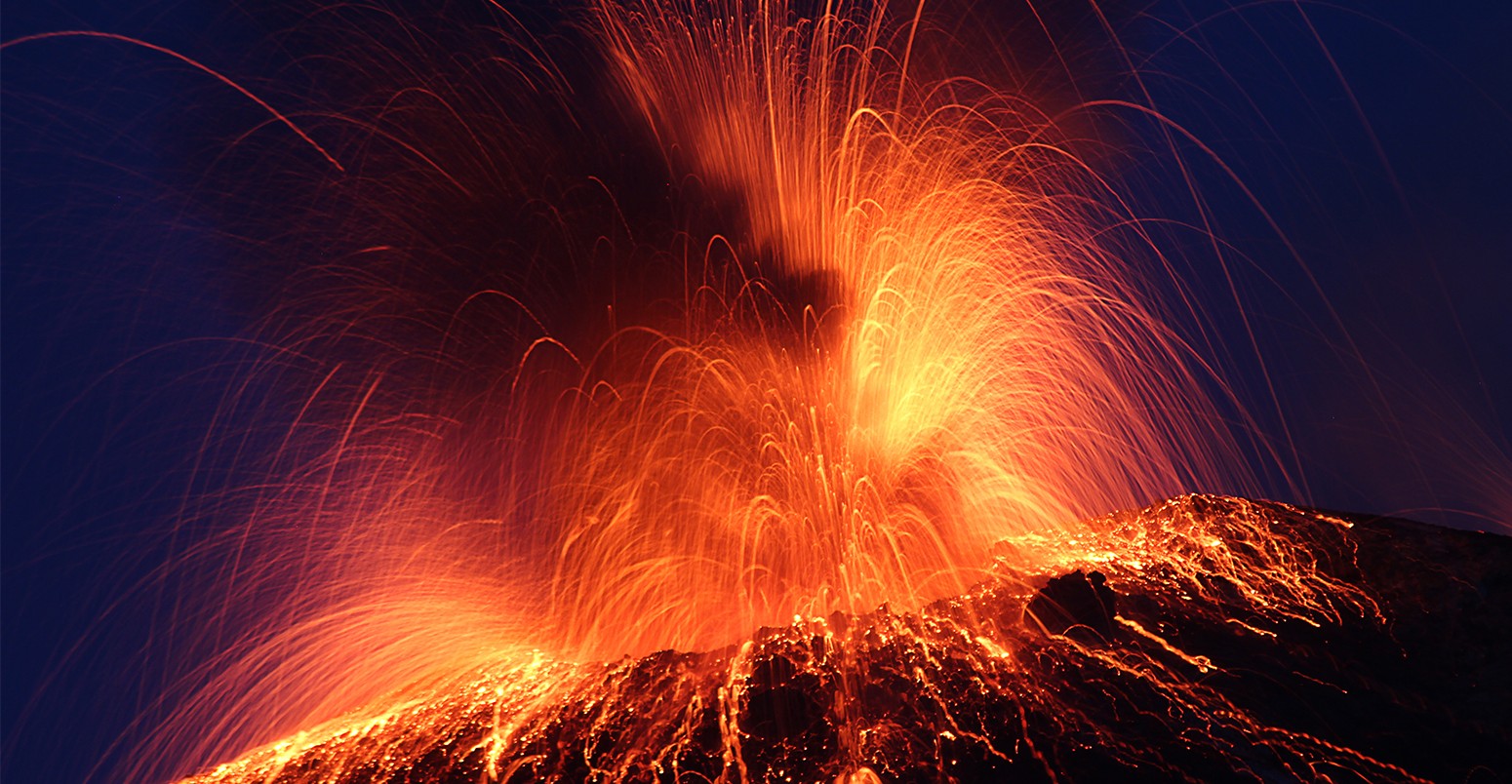 Stromboli volcano erupting at night