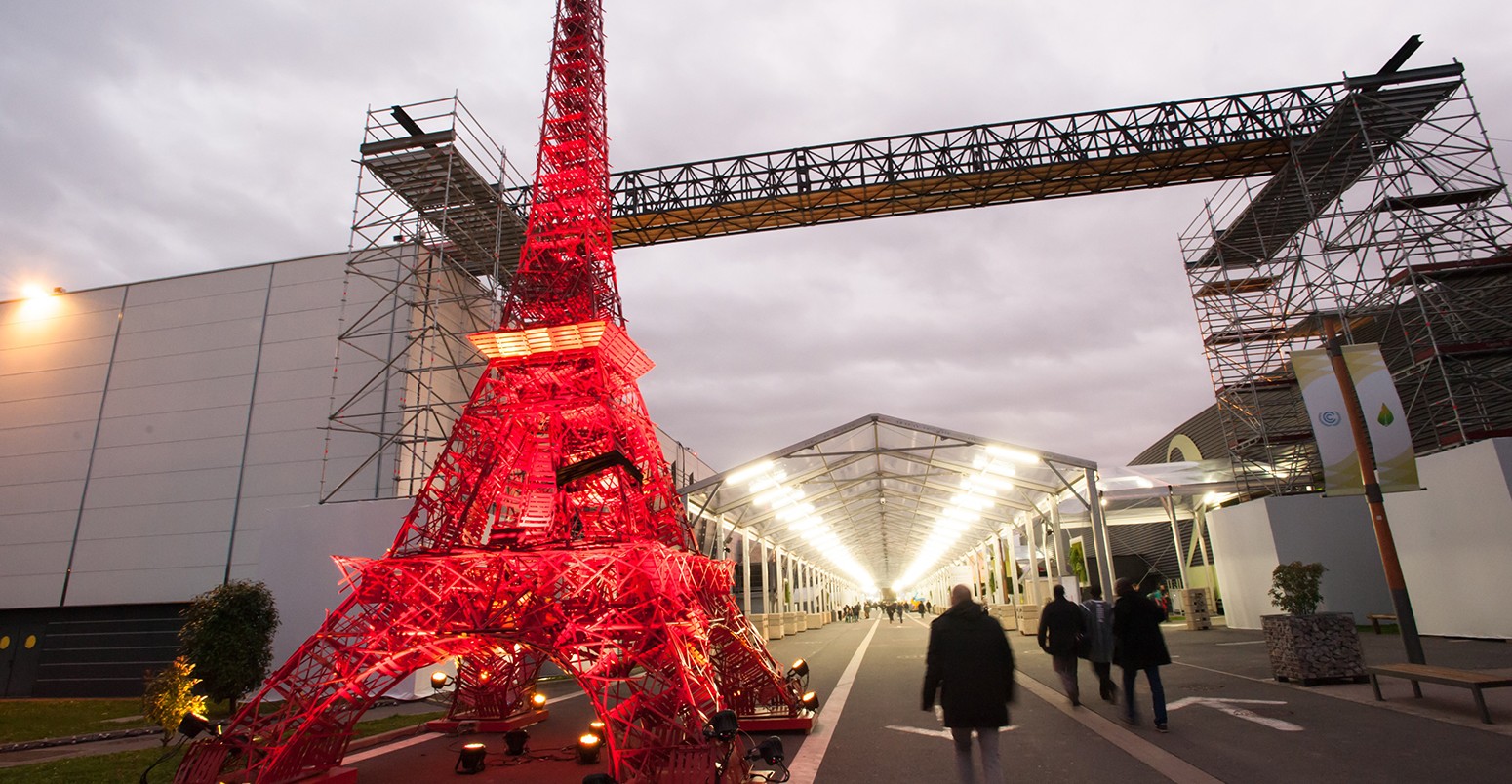 A model of the Eiffel Tower made from recycled folding chairs stands at an entrance to the COP21 United Nations climate summit in Le Bourget near Paris, France.