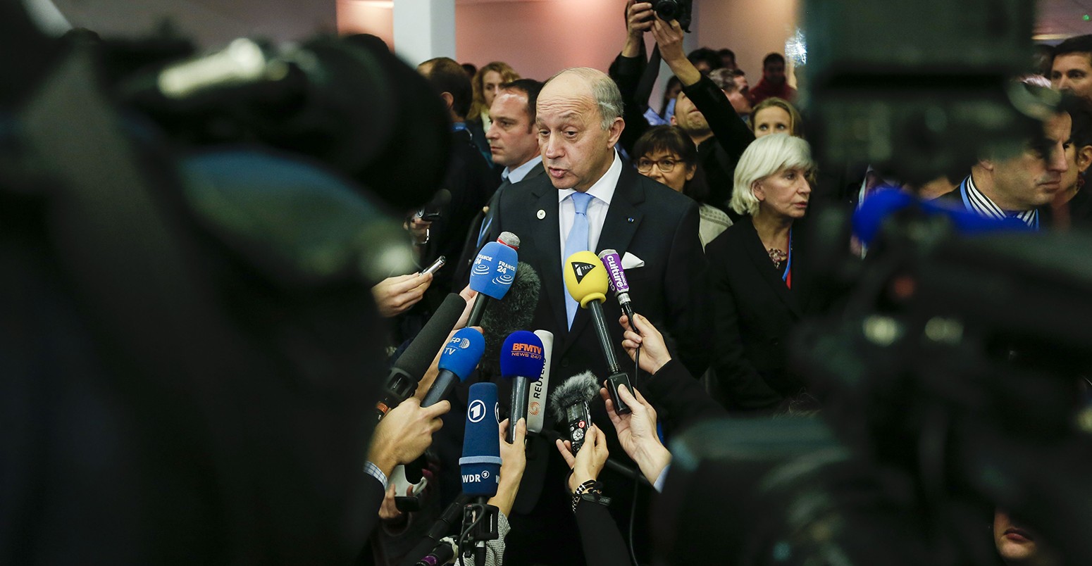 French Foreign Minister and president of the COP21 Laurent Fabius makes a statement during Paris Climate Change Conference at Le Bourget on the northern suburbs of Paris, France, Dec. 11, 2015. "All the conditions are ripe to reach a universal and ambitious agreement," Laurent Fabius said Friday evening.