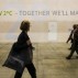 People walk past the slogan of 'Below 2 degrees' at the site of the 2015 United Nations Climate Change Conference (COP 21) at Le Bourget on the northern suburbs of Paris, France, Dec. 2, 2015.