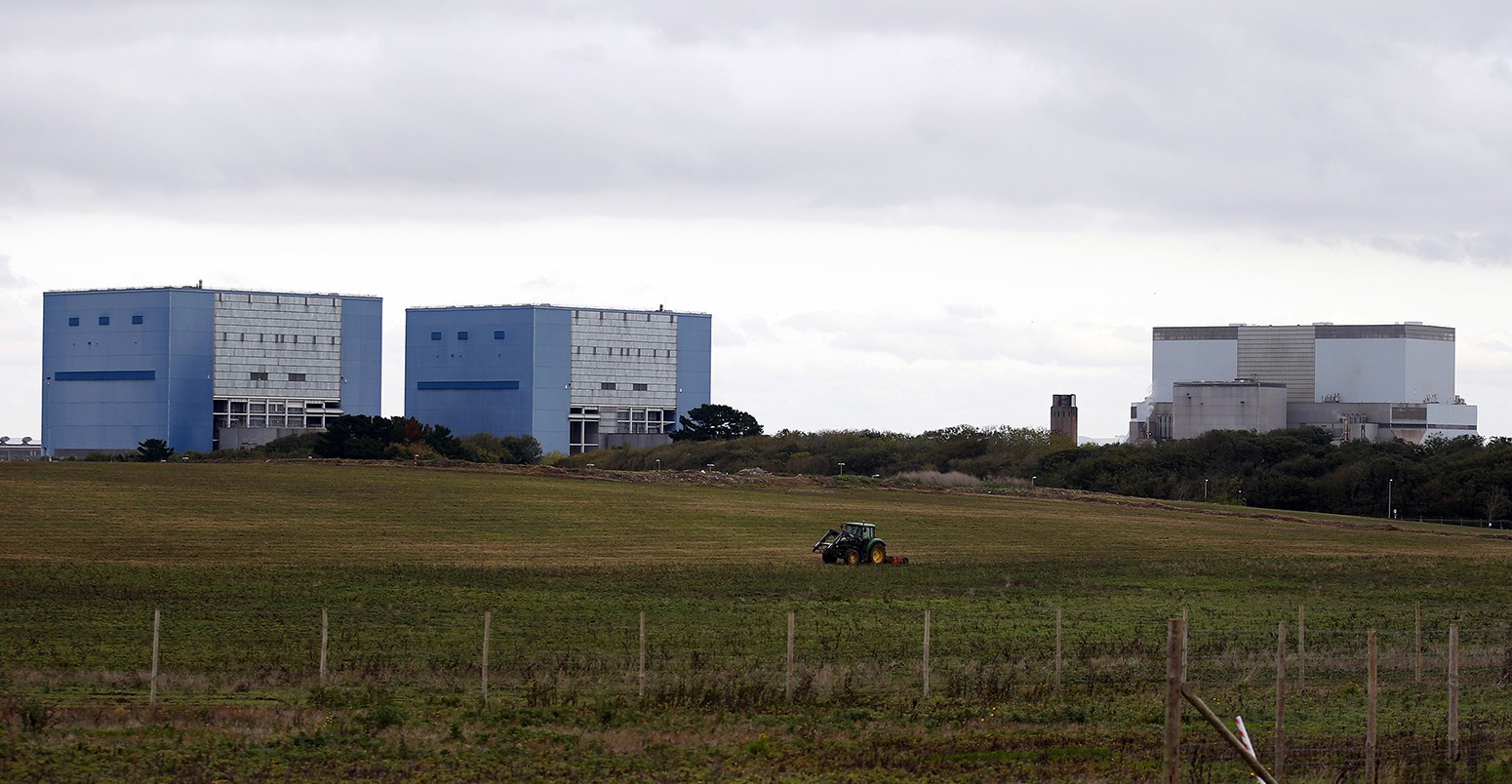 Picture of a tractor mowing a field on the site where EDF Energy's Hinkley Point C nuclear power station will be constructed in Bridgwater, southwest England