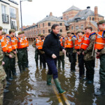 Britain's Prime Minister David Cameron greets soldiers working on flood relief in York city centre after the river Ouse burst its banks, in northern England, December 28, 2015. REUTERS/Darren Staples
