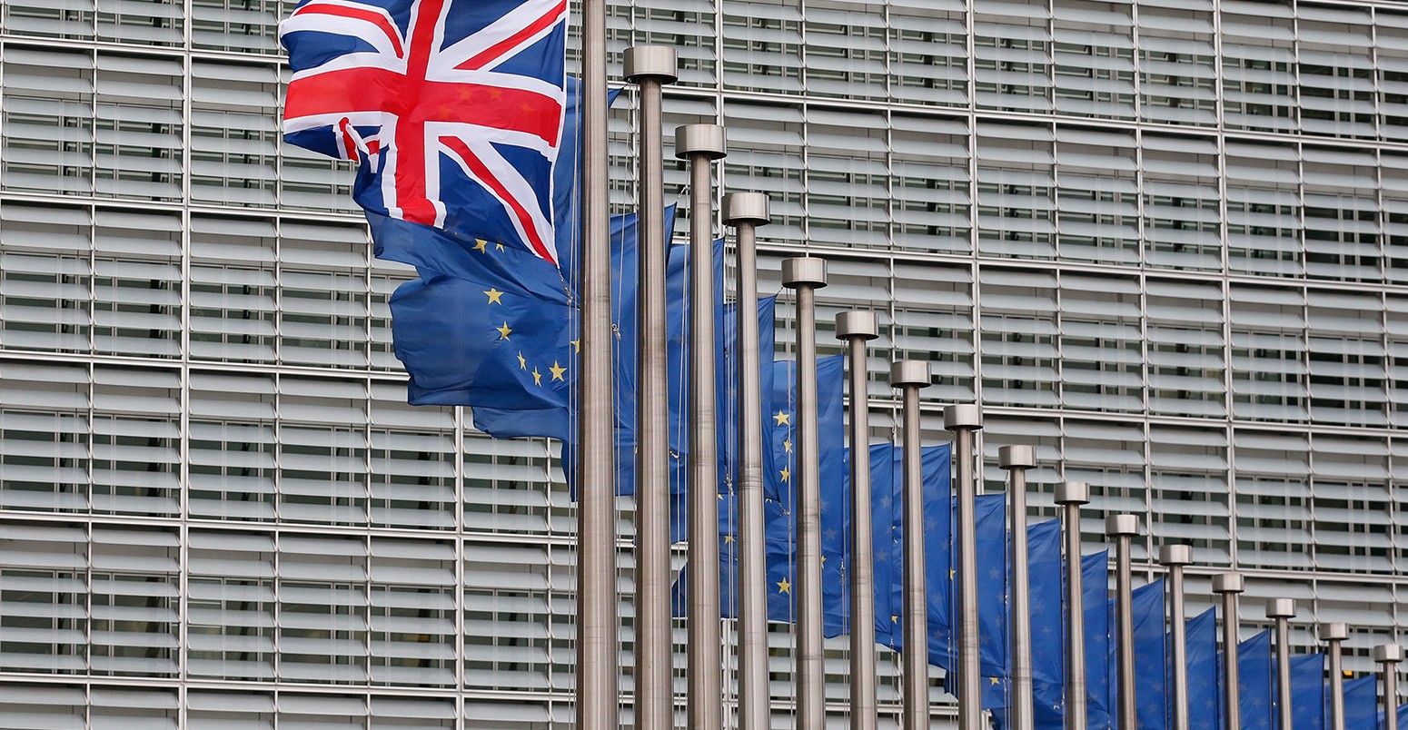 A Union Jack flag flutters next to European Union flags ahead a visits of the British Prime Minister David Cameron at the European Commission in Brussels, Belgium, 29 January 2016.