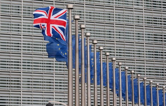 A Union Jack flag flutters next to European Union flags ahead a visits of the British Prime Minister David Cameron at the European Commission in Brussels, Belgium, 29 January 2016.