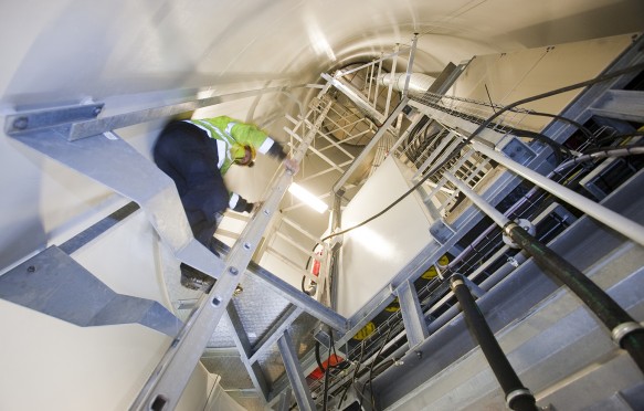 Engineer inside wind turbine at Walney Offshore Windfarm project