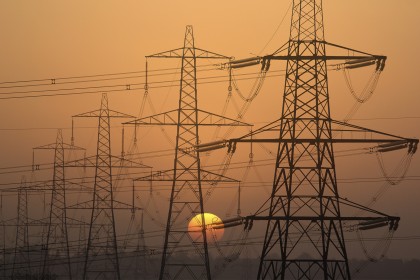 Electricity pylons at sunset in Radley Village, Oxfordshire England