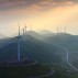 Wind turbines whirl to generate electricity at the Wangying Wind Farm in Lichuan city, central Chinas Hubei province