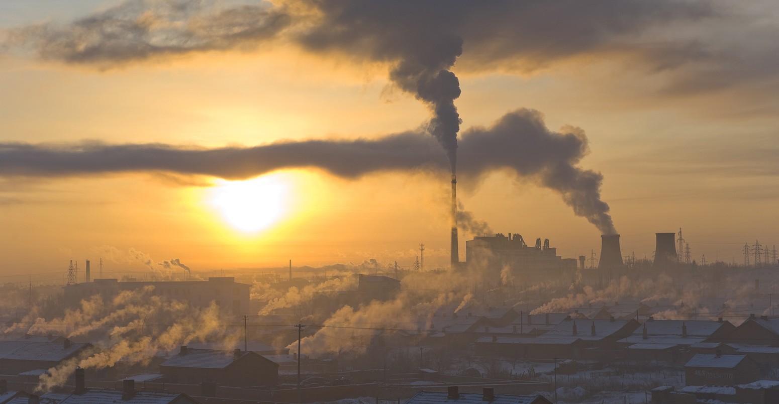 Power plant and a village in early morning in winter, north China