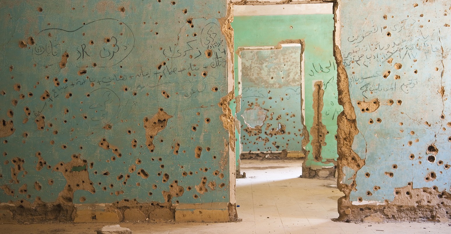 Interior view of the abandoned and bullet-scarred hospital in Quneitra, Syria. Quneitra was occupied by Israel for seven years beginning in 1967. Today, though decades have passed since the Israeli withdrawal, the town has been left in its destroyed state.