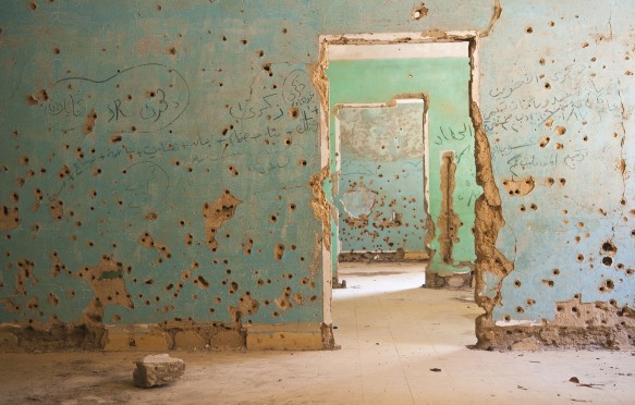 Interior view of the abandoned and bullet-scarred hospital in Quneitra, Syria. Quneitra was occupied by Israel for seven years beginning in 1967. Today, though decades have passed since the Israeli withdrawal, the town has been left in its destroyed state.