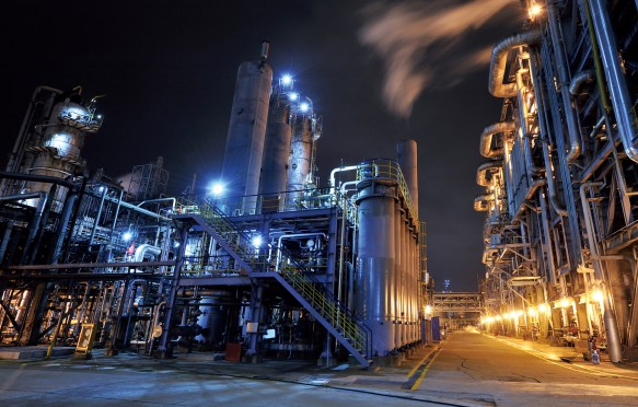 Oil refinery, chemical and petrochemical plant at night.
