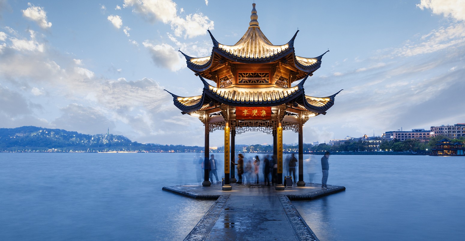 Ancient pavilion building of Hangzhou west lake at dusk, in China