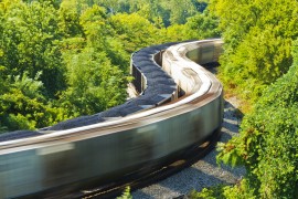 Stationary coal train is passed by a freight train , Virginia, US