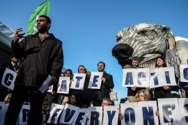 Kumi Naidoo, Executive Director of Greenpeace International participates in a action at COP 21 in Paris. © Joel Lukhovi/Survival Media Agency.