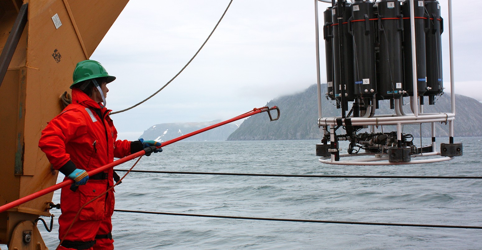 Holley Kelly helps retrieve the CTD/Rosette ensemble from the Bering Strait, east of the Diomede Islands, June 2011