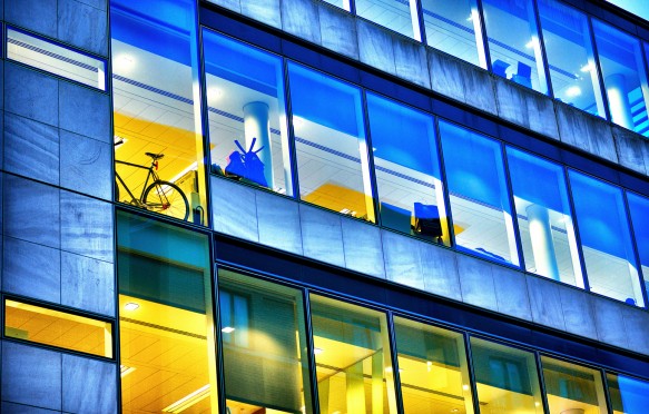 Glass business offices in London at dawn.