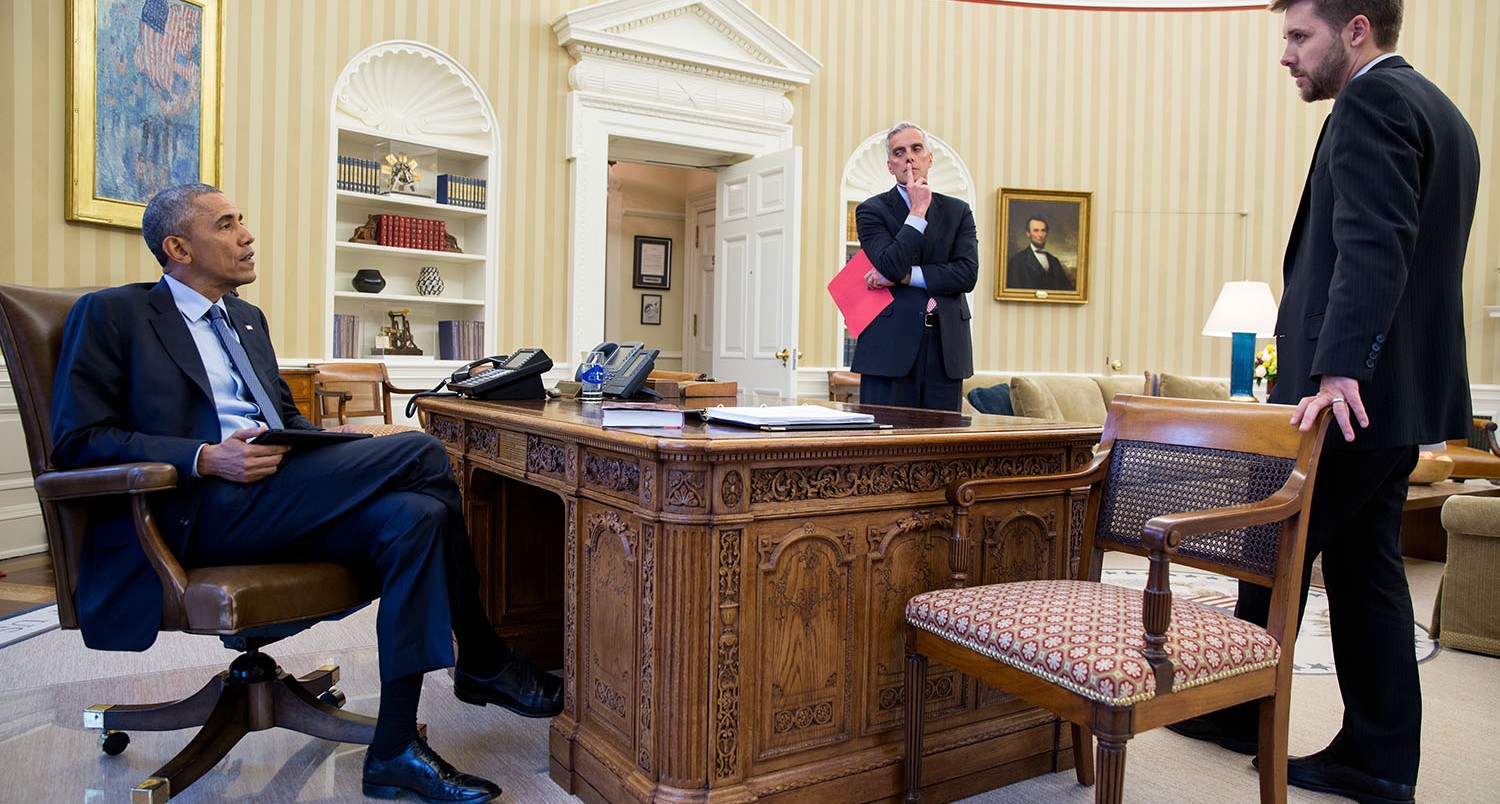 President Barack Obama meets with Chief of Staff Denis McDonough and Senior Advisor Brian Deese, right, in the Oval Office