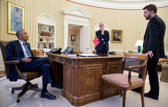 President Barack Obama meets with Chief of Staff Denis McDonough and Senior Advisor Brian Deese, right, in the Oval Office