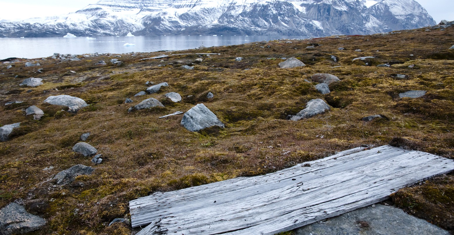 A cabin door from a WWII outpost lies on the permafrost in Greenland