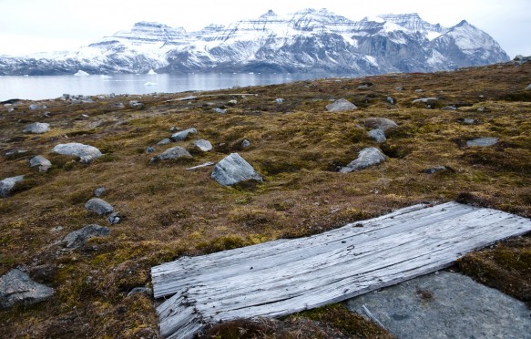 A cabin door from a WWII outpost lies on the permafrost in Greenland