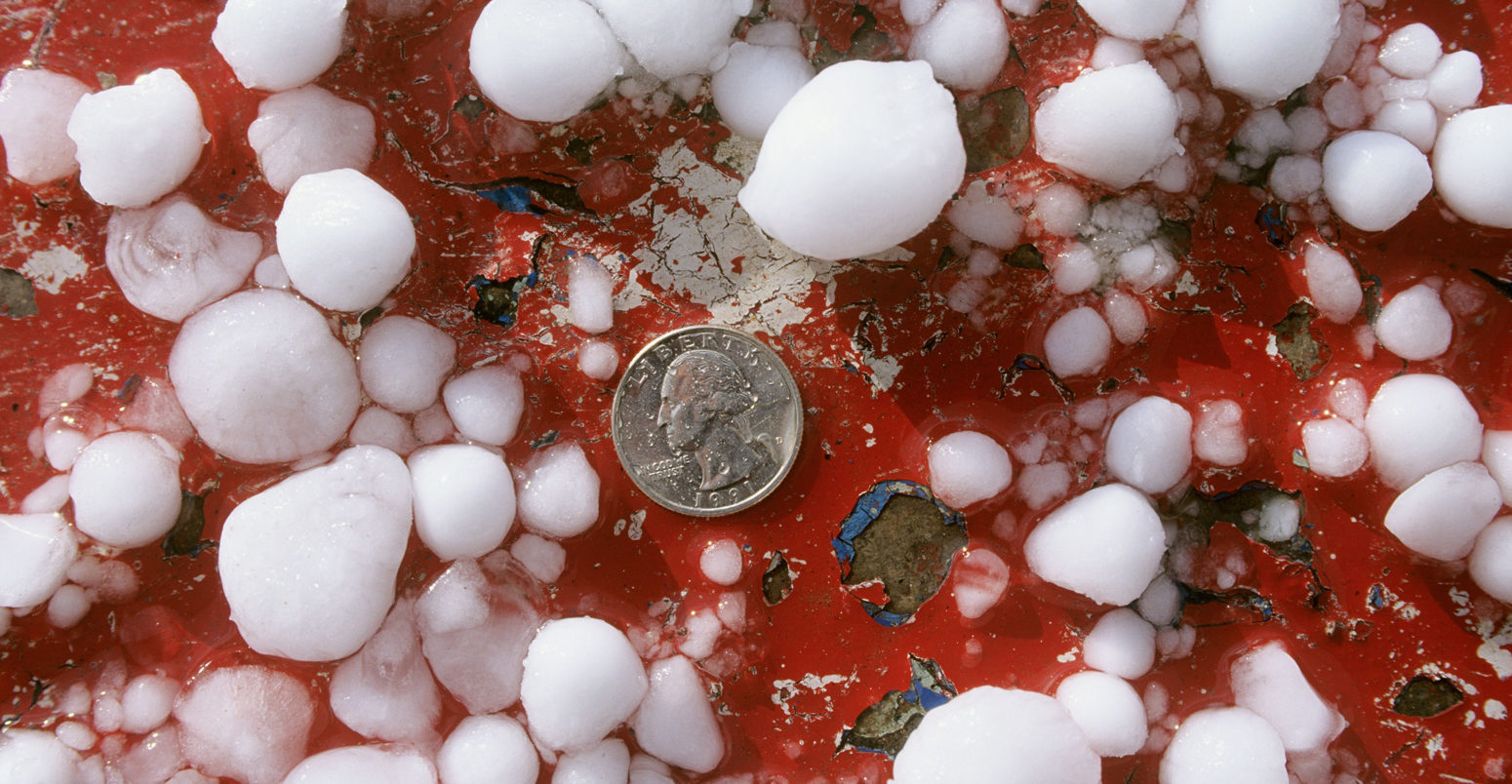 US quarter with .75 (golfball) inch size hail stones from severe thunderstorm near Coolidge Arizon