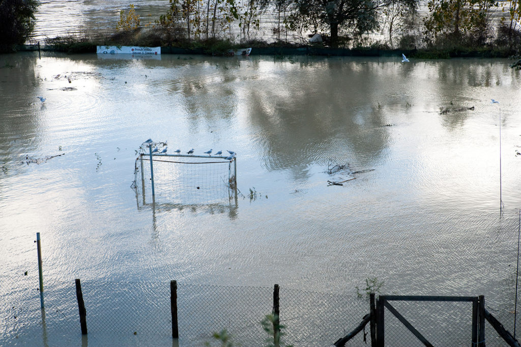 Football goalposts emerge from a flooded field close the river, near Ponte Milvio, Italy, 11/2010.