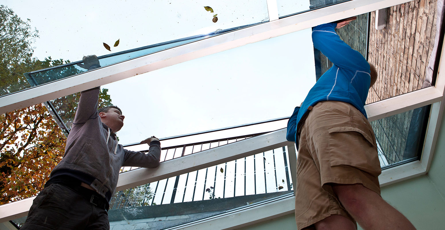 Double-glazing windows being installed on conservatory roof