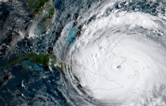GOES-16 satellite image released by NOAA taken on September 8, 2017 shows Hurricane Irma passing the eastern end of Cuba at about on September 8, 2017.