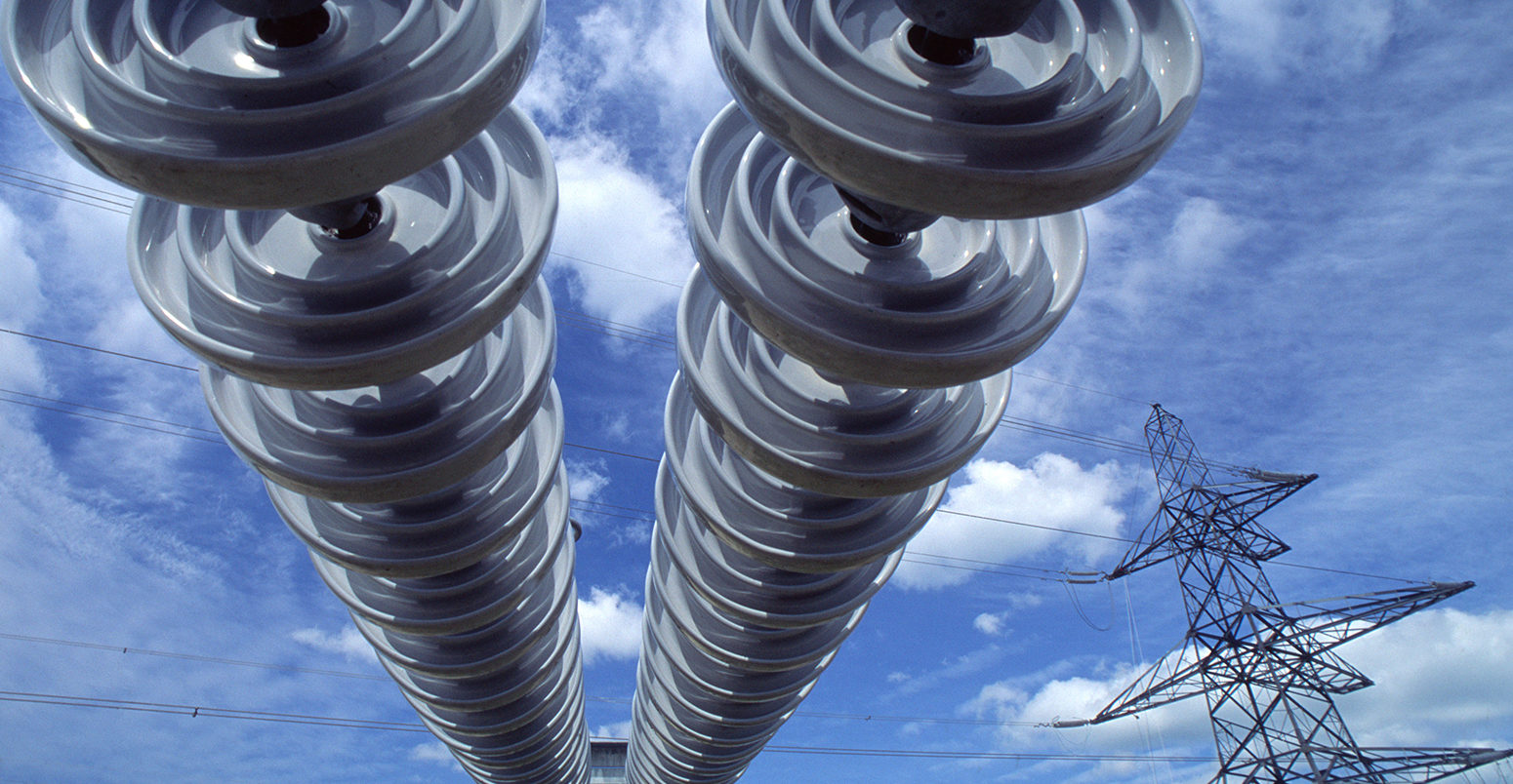 A30C8F Electricity Insulators on power line on electricity grid