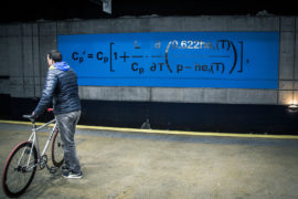 One of 42 panels displayed throughout the Gare du Nord metro station in Paris, honouring Syukuro Manabe and his contributions to climate science, to mark the COP21 UN climate change conference in 2015. The equations were used by Manabe in his seminal climate model in the late 1960s. Credit: NOAA/Rory O'Connor.