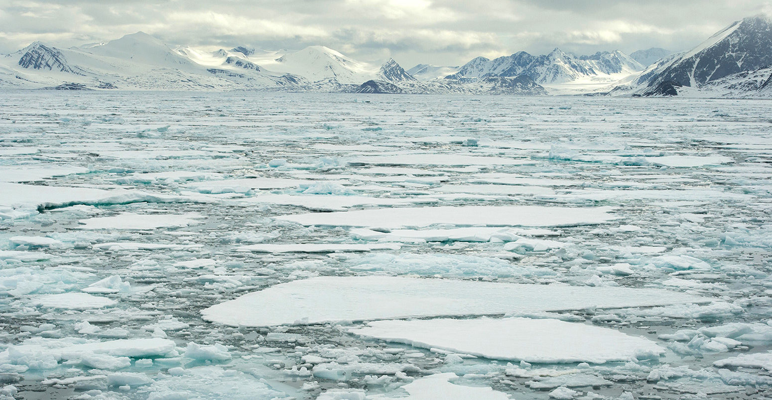 Sea ice and Arctic mountains of Raudfjord, Spitsbergen on the Svalbard Archipelago. Credit: Josh Harrison / Alamy Stock Photo. ED92R5