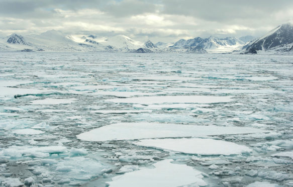 Sea ice and Arctic mountains of Raudfjord, Spitsbergen on the Svalbard Archipelago. Credit: Josh Harrison / Alamy Stock Photo. ED92R5