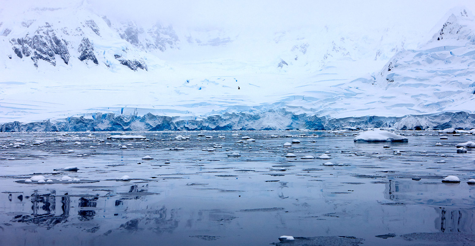 Ice shelf glacier falling into the sea, Fournier Bay, Antarctica. Credit: Radharc Images / Alamy Stock Photo. E06HF5