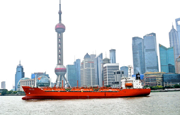 Yosu Gas ship on Huangpu river before the skyline of Pudong, Shanghai, China.