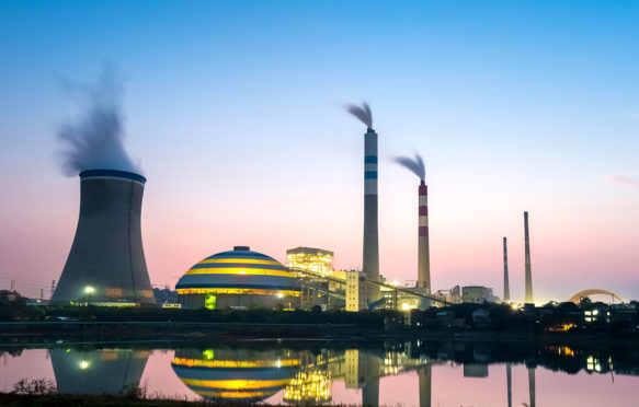 A coal-fired power plant at dusk, China. Credit: Zoonar GmbH / Alamy Stock Photo. EJCD56