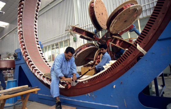 Production of a wind turbine generator at Daman Enercon India Ltd. Credit: Joerg Boethling / Alamy Stock Photo. C5WWNX