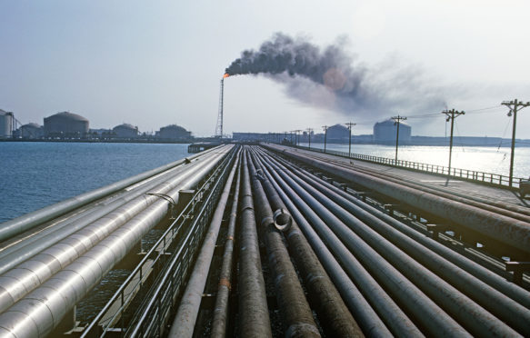 Ras Tanura oil refinery, Saudi Arabia. Credit: Tom Hanley / Alamy Stock Photo. A9EG3T