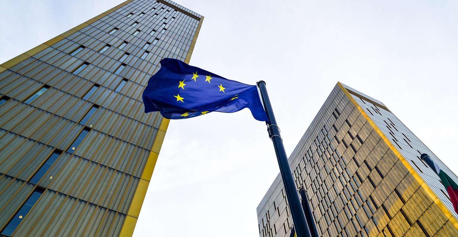 EP6P4C Golden twin towers of the Court of Justice of the European Union, in European Quarter, Kirchberg, Luxembourg, behind the EU flag