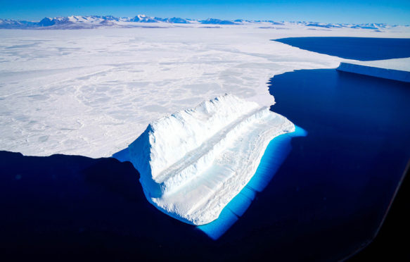 Sea ice and an iceberg in McMurdo Sound.