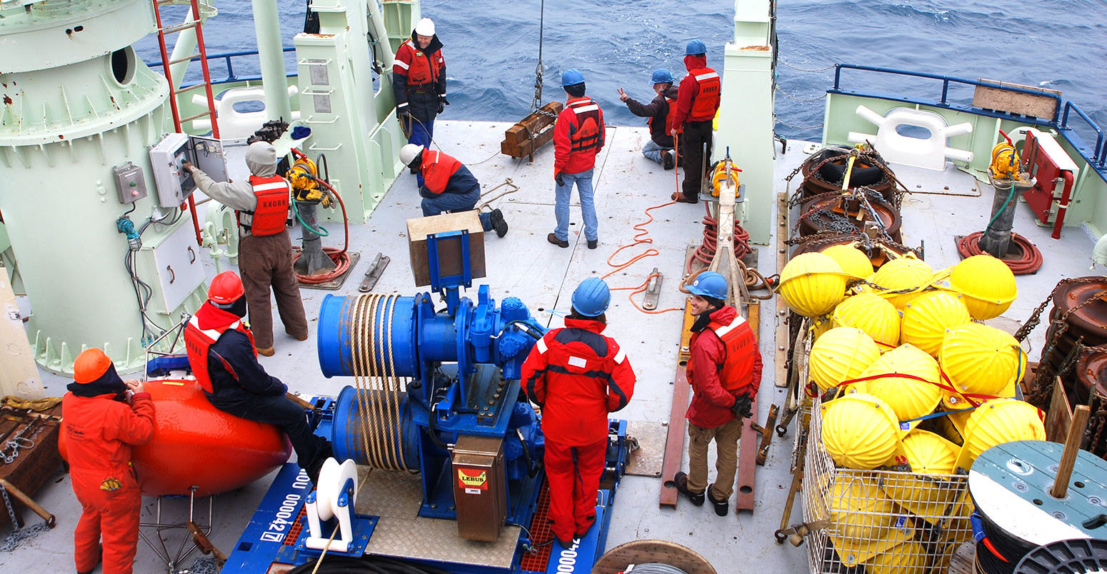 The deployment of the first OSNAP science mooring, named 'IC0', which measured water column properties on the western flank of the Reykjanes Ridge as part of the OSNAP array. July 2014. Credit: Credit: Heather Furey, Woods Hole Oceanographic Institution