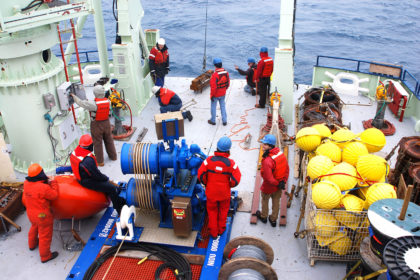 The deployment of the first OSNAP science mooring, named 'IC0', which measured water column properties on the western flank of the Reykjanes Ridge as part of the OSNAP array. July 2014. Credit: Credit: Heather Furey, Woods Hole Oceanographic Institution