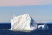 Iceberg floating in ocean water of Smith Sound in the high arctic of Nunavut, Canada, mid summer.