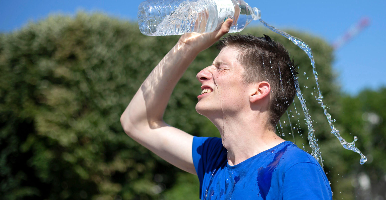 A man cools himself in Lille, France, 28 June 2019, as temperatures in France hit 45C. Credit: Xinhua / Alamy Stock Photo.