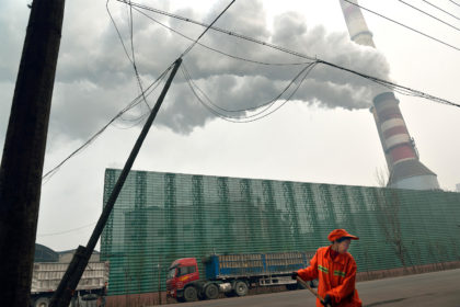 A steel factory emits smoke in Tangshan, Hebei province, China. Credit: Lou Linwei / Alamy Stock Photo.