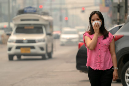 A woman wears a protective mask in Chiang Mai, Thailand. Credit: Anan Kaewkhammul / Alamy Stock Photo. T19P7D