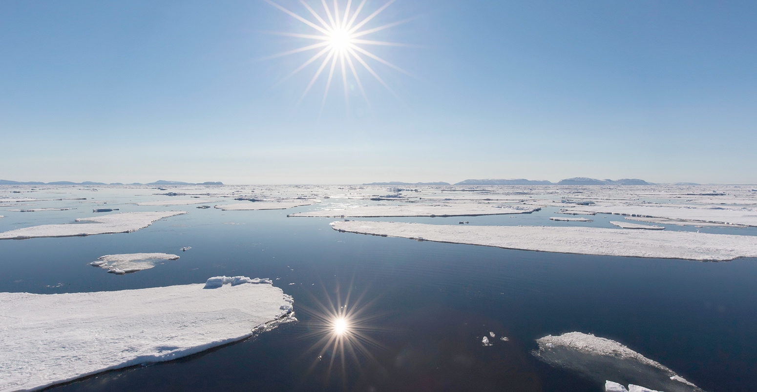 Midnight sun over the Arctic Ocean, Svalbard, Norway. Credit: Arterra Picture Library / Alamy Stock Photo.